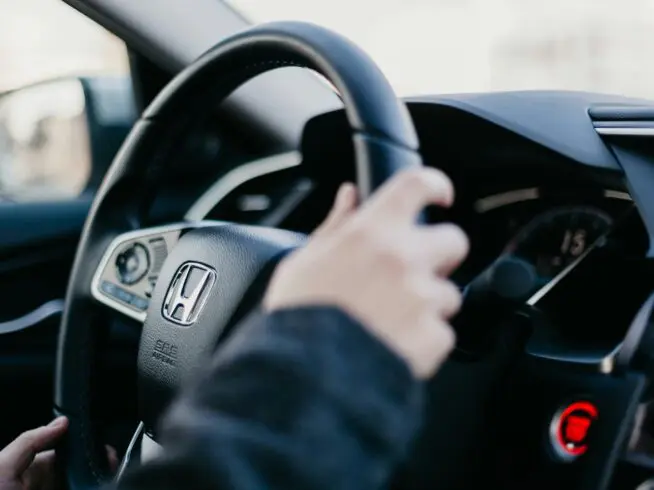 Person driving a car.