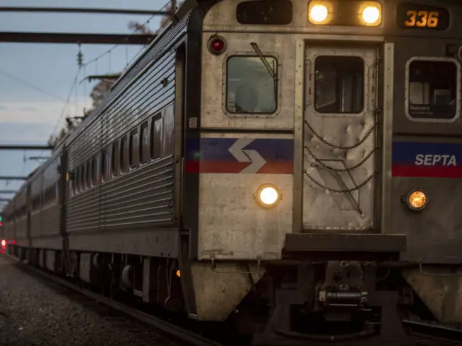 A SEPTA train on the West Trenton Line, headed for Center City in Philadelphia, approaches the Woodbourne station shortly before sunset Monday, Oct. 25, 2021, in Langhorne, Pennsylvania.