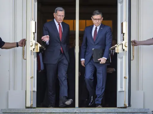 Sen. John Barrasso, R-Wyoming, the Senate GOP whip, left, and Speaker of the House Mike Johnson, R-Louisiana, right, arrive for a news conference with top Republicans on the government shutdown, at the Capitol in Washington, Wednesday, Oct. 1, 2025